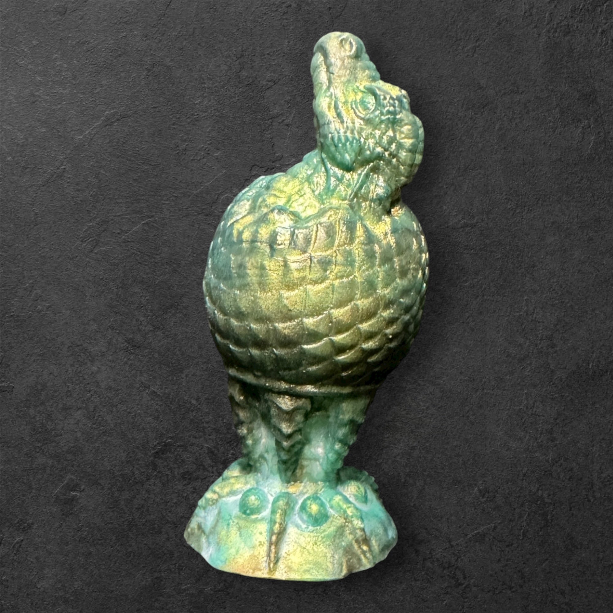 The Fire Egg Fantasy Plug. Textured dragon egg with hatching head at the tip and sculpted dragon claw safety base. Platinum Silicone by ClimaxLab.