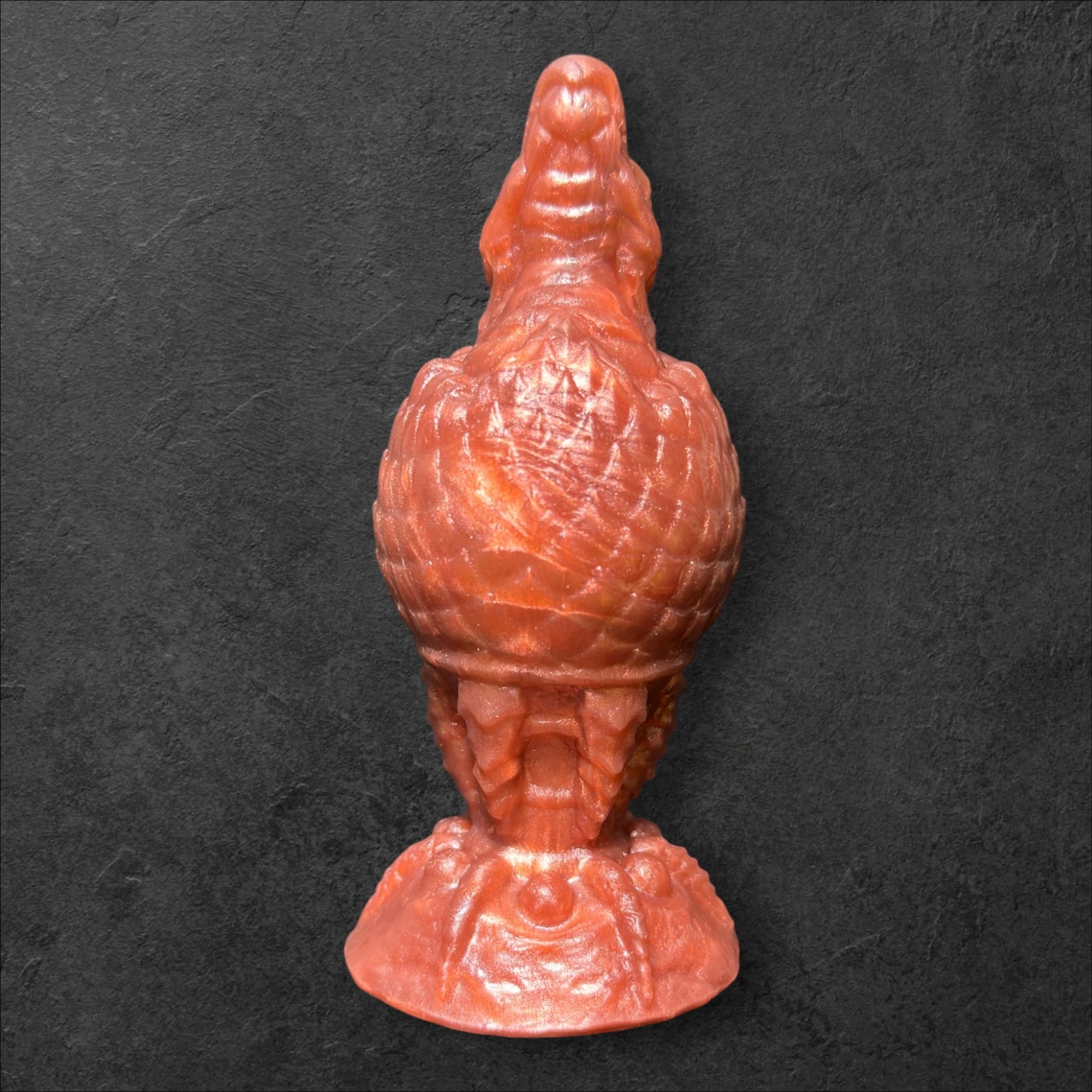 The Fire Egg Fantasy Plug. Textured dragon egg with hatching head at the tip and sculpted dragon claw safety base. Platinum Silicone by ClimaxLab.