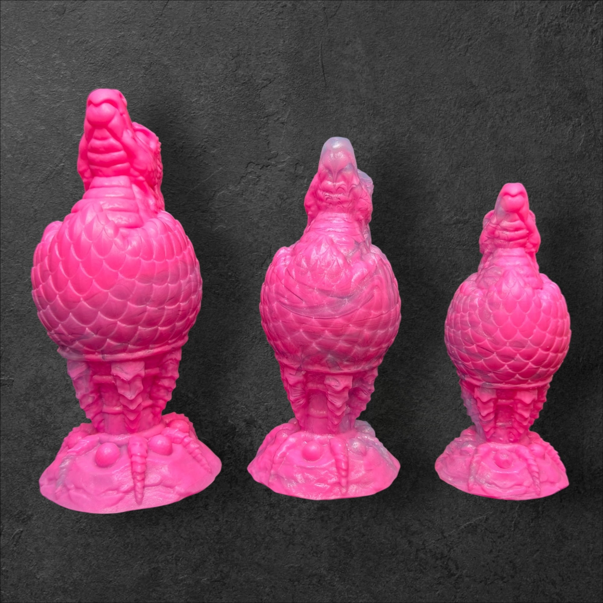 The Fire Egg Fantasy Plug. Textured dragon egg with hatching head at the tip and sculpted dragon claw safety base. Platinum Silicone by ClimaxLab.