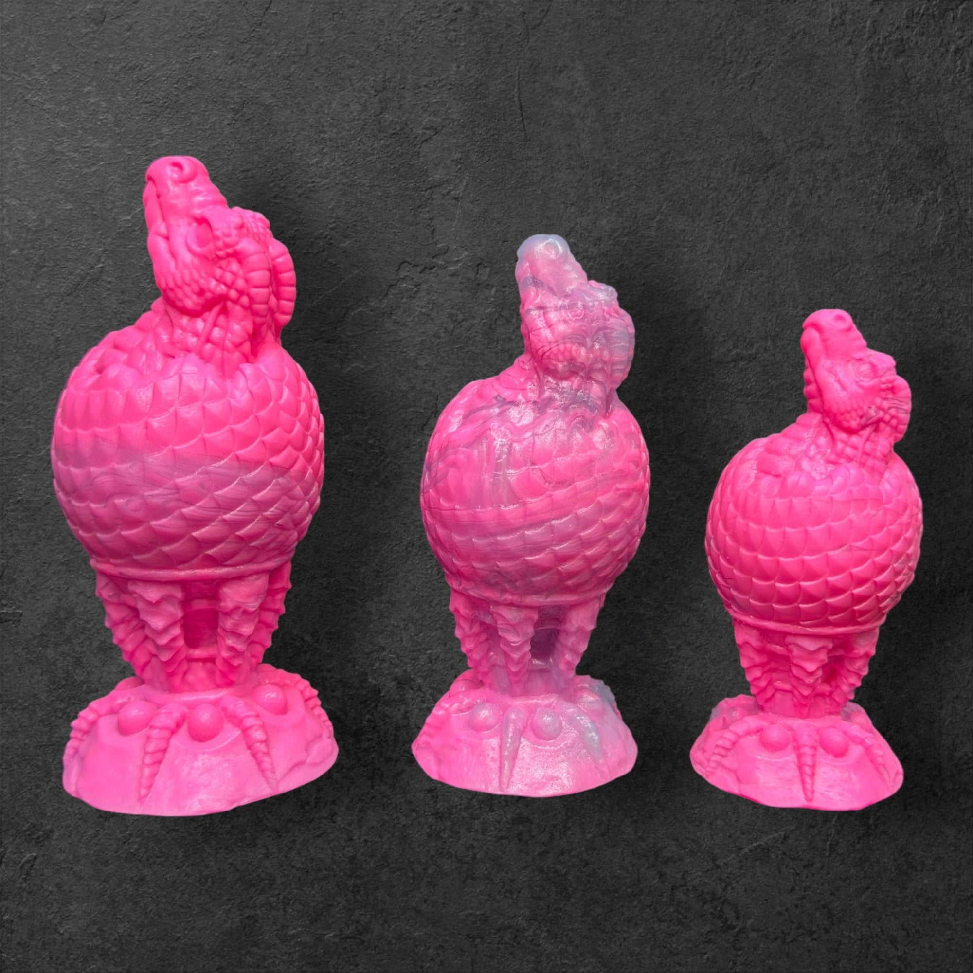 The Fire Egg Fantasy Plug. Textured dragon egg with hatching head at the tip and sculpted dragon claw safety base. Platinum Silicone by ClimaxLab.