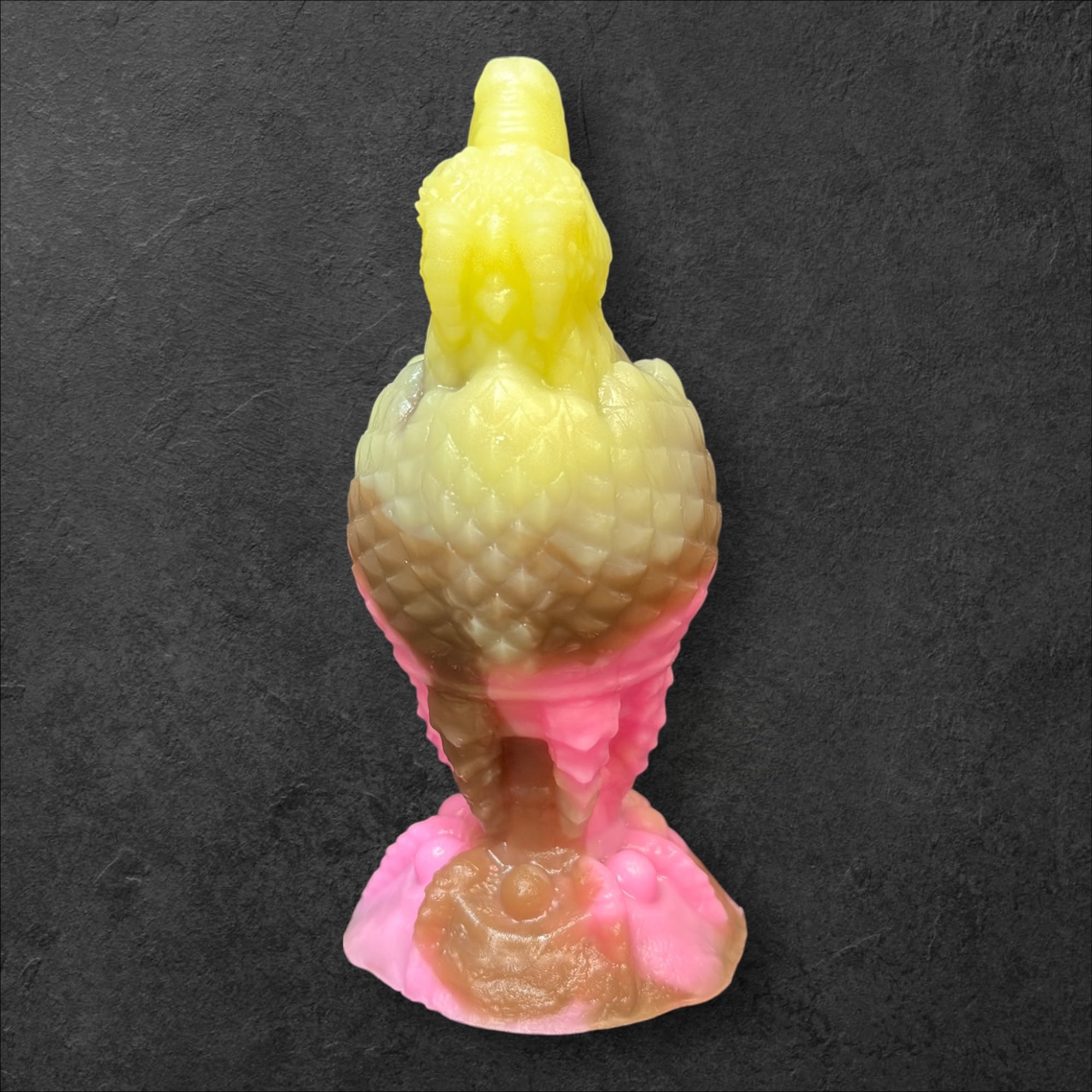 The Fire Egg Fantasy Plug. Textured dragon egg with hatching head at the tip and sculpted dragon claw safety base. Platinum Silicone by ClimaxLab.