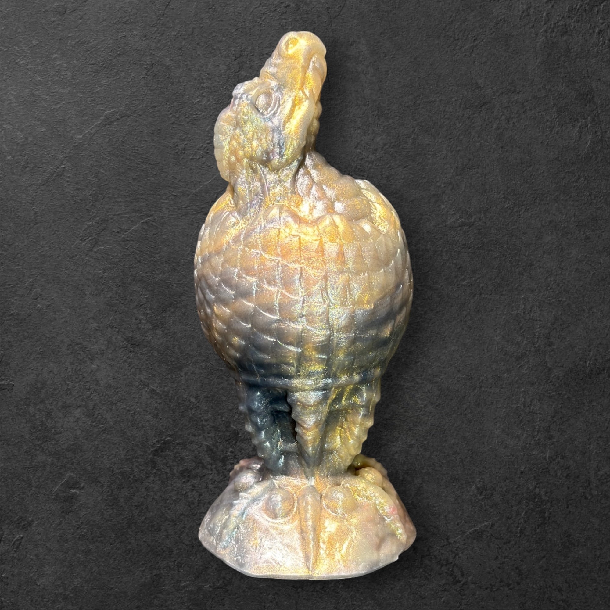 The Fire Egg Fantasy Plug. Textured dragon egg with hatching head at the tip and sculpted dragon claw safety base. Platinum Silicone by ClimaxLab.