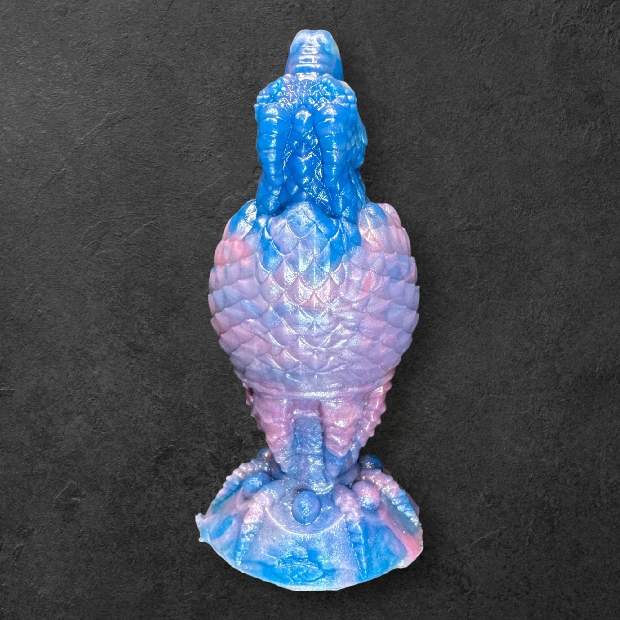 The Fire Egg Fantasy Plug. Textured dragon egg with hatching head at the tip and sculpted dragon claw safety base. Platinum Silicone by ClimaxLab.