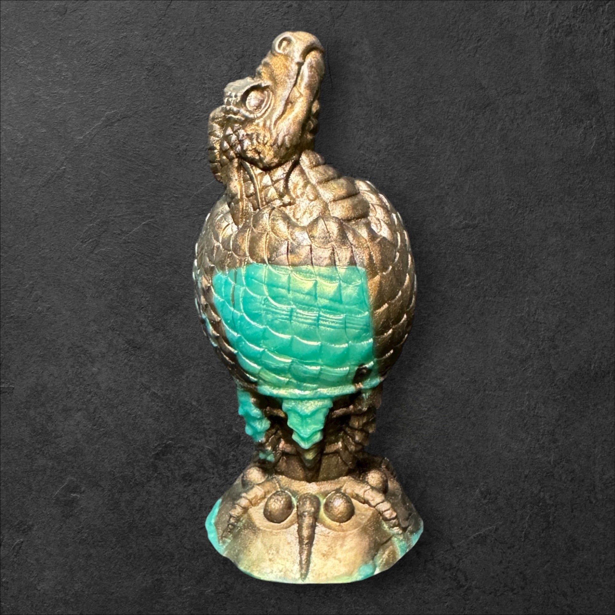 The Fire Egg Fantasy Plug. Textured dragon egg with hatching head at the tip and sculpted dragon claw safety base. Platinum Silicone by ClimaxLab.