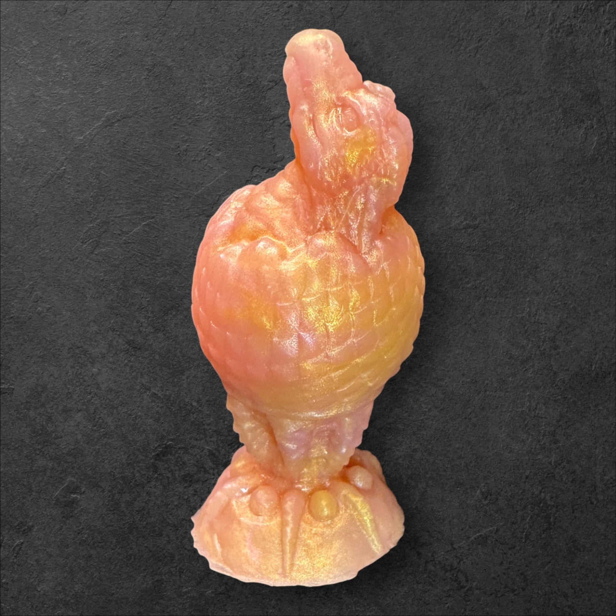 The Fire Egg Fantasy Plug. Textured dragon egg with hatching head at the tip and sculpted dragon claw safety base. Platinum Silicone by ClimaxLab.