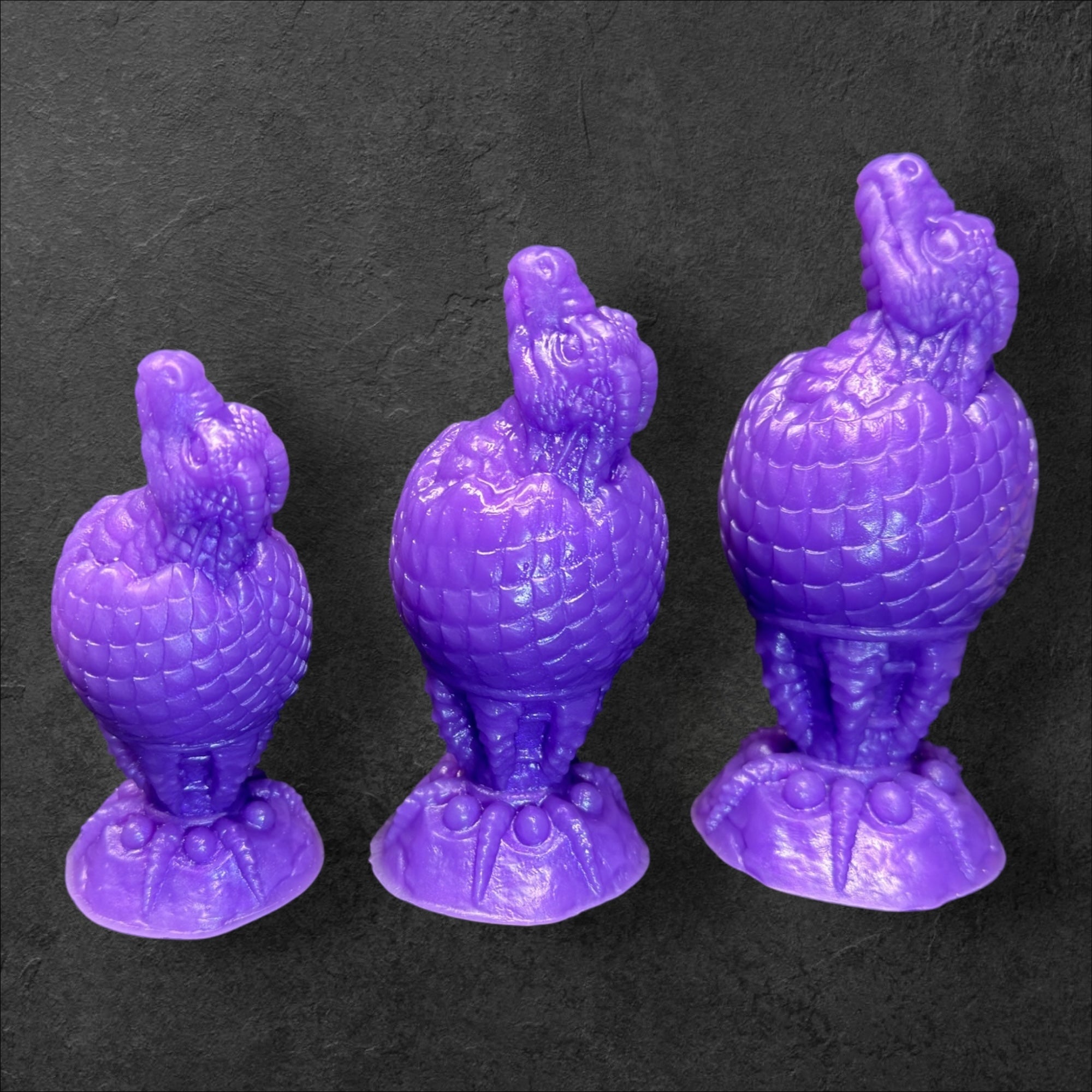 The Fire Egg Fantasy Plug. Textured dragon egg with hatching head at the tip and sculpted dragon claw safety base. Platinum Silicone by ClimaxLab.