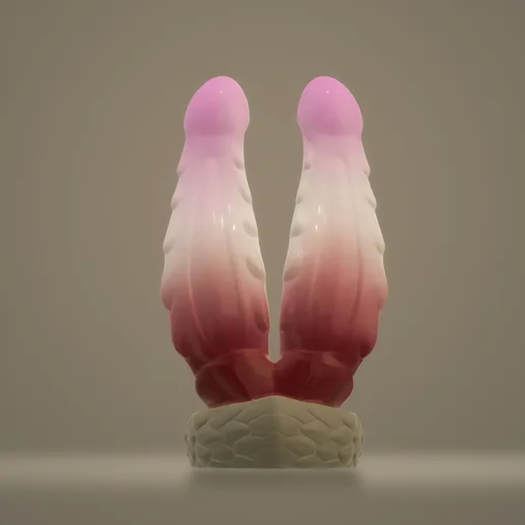 Wyrm Hemis double dragon dildo, front view of the two parallel shafts on a braided base — platinum silicone, ClimaxLab.