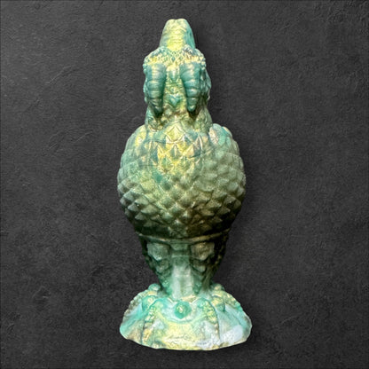 The Fire Egg Fantasy Plug. Textured dragon egg with hatching head at the tip and sculpted dragon claw safety base. Platinum Silicone by ClimaxLab.