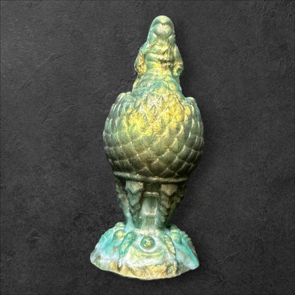 The Fire Egg Fantasy Plug. Textured dragon egg with hatching head at the tip and sculpted dragon claw safety base. Platinum Silicone by ClimaxLab.