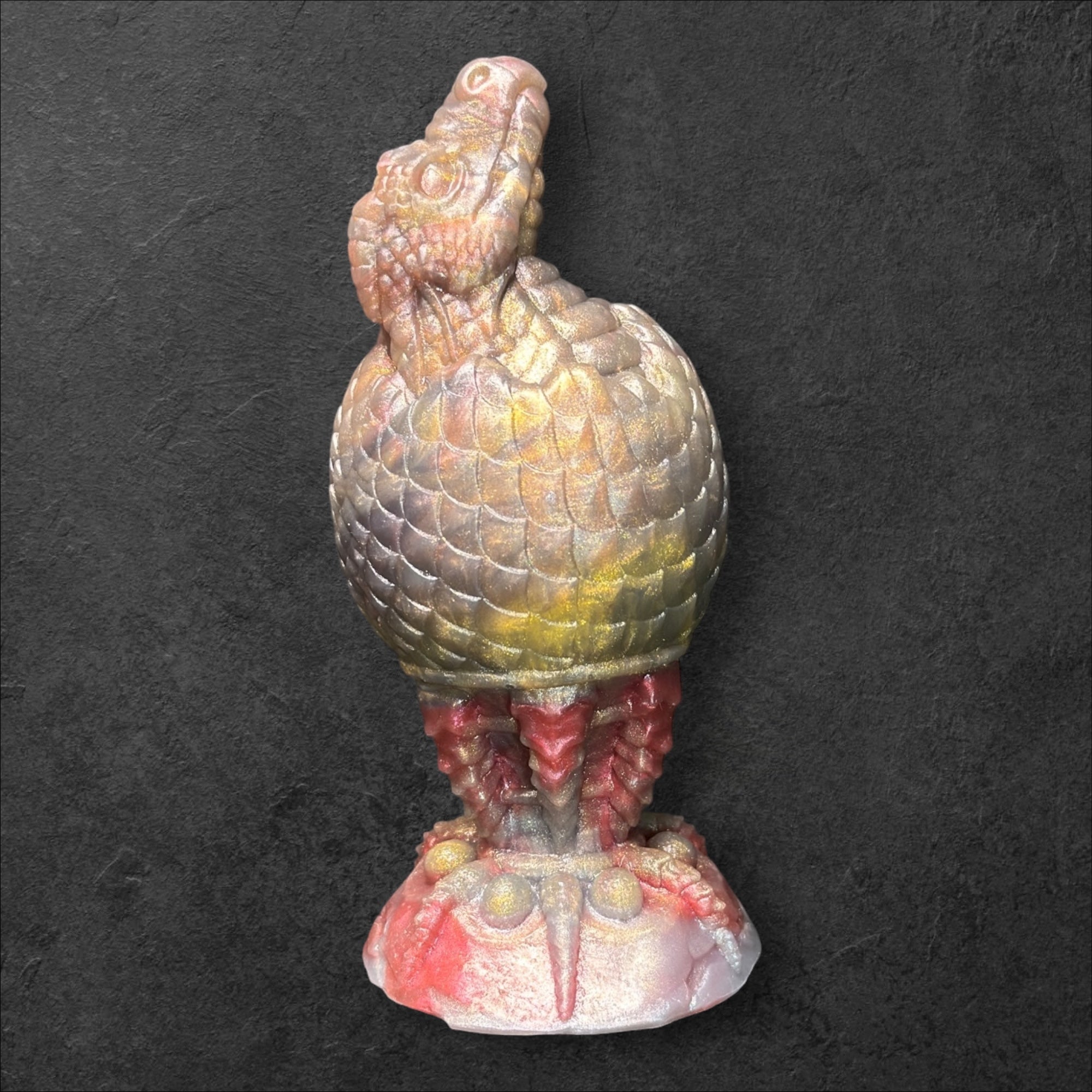 The Fire Egg Fantasy Plug. Textured dragon egg with hatching head at the tip and sculpted dragon claw safety base. Platinum Silicone by ClimaxLab.