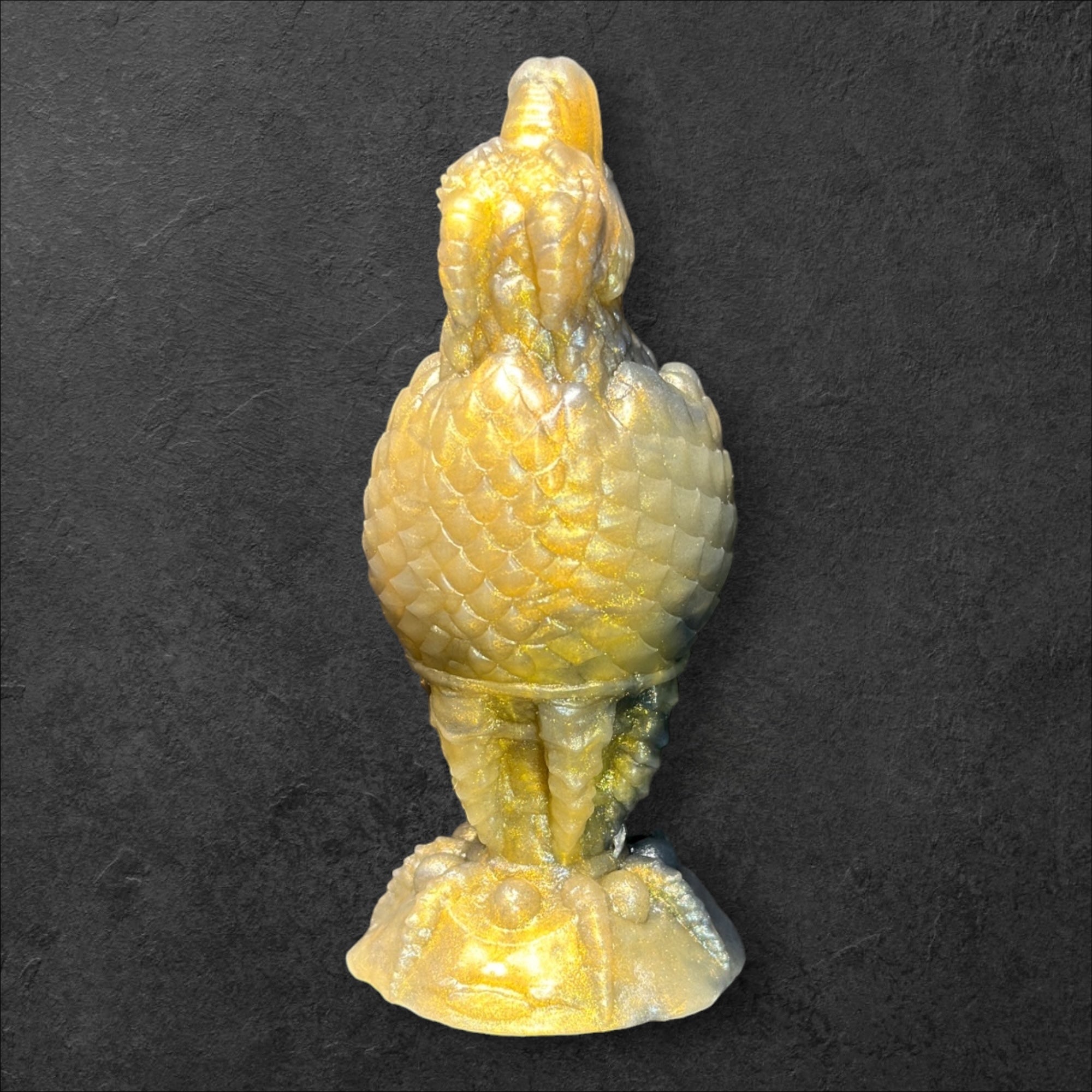The Fire Egg Fantasy Plug. Textured dragon egg with hatching head at the tip and sculpted dragon claw safety base. Platinum Silicone by ClimaxLab.