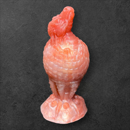 The Fire Egg Fantasy Plug. Textured dragon egg with hatching head at the tip and sculpted dragon claw safety base. Platinum Silicone by ClimaxLab.