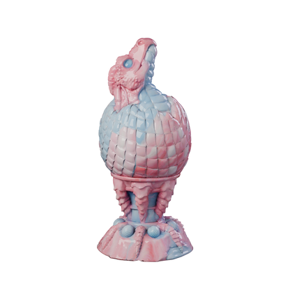 Huevo del Fuego dragon egg plug with hatching head and claw base, front view — platinum silicone by ClimaxLab.